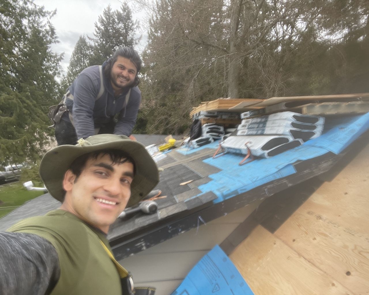 Scarlet Roofing & Gutters crew on a residential job site in Surrey, BC