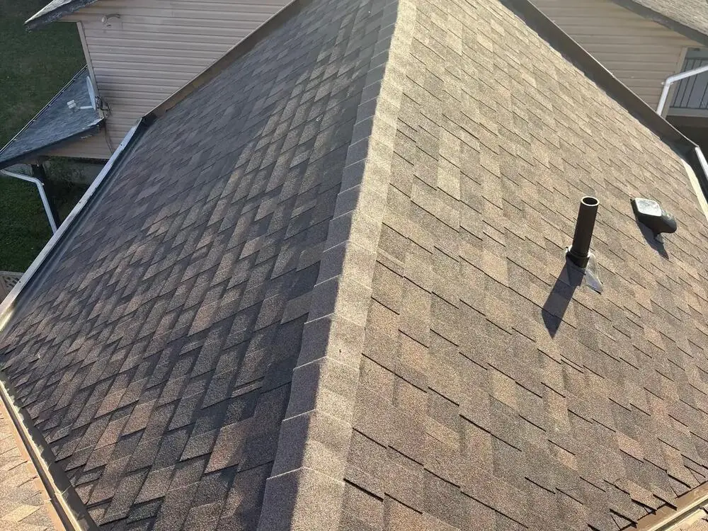 Finished roof replacement with new grey architectural shingles on a Vancouver home