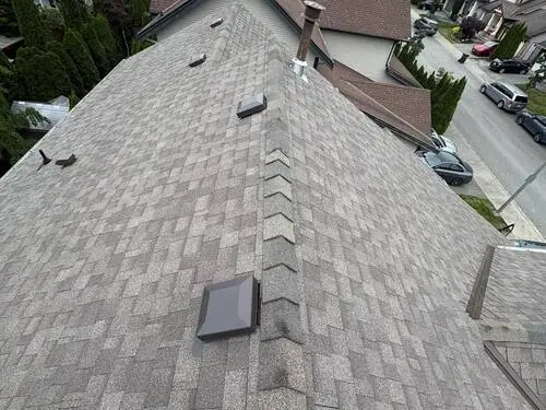Flat Roof Torch-On — Torching the modified-bitumen membrane down at the roof edge.
