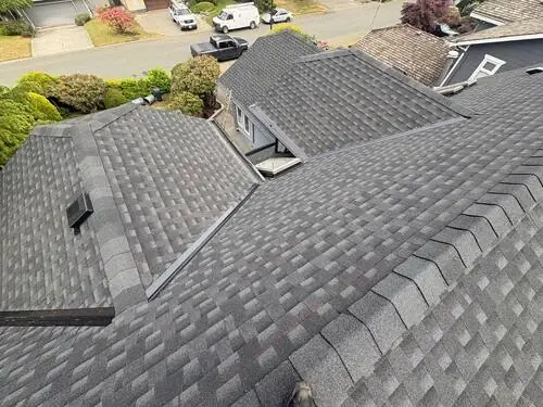 Full Roof Replacement — Aerial view of the completed roof across the whole home.