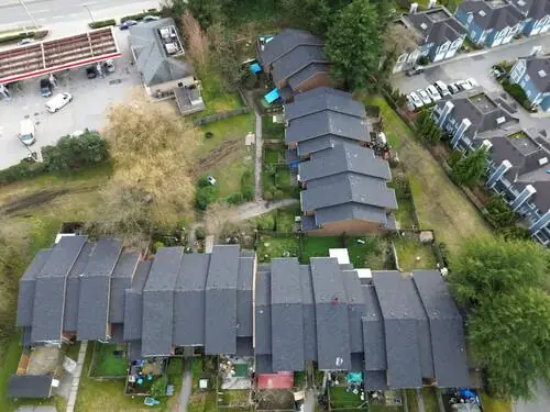 Full Roof Replacement — Drone view of the full property and the completed roofline.