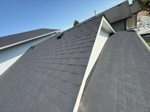 Storm Damage Restoration — Fresh underlayment going down over the repaired deck.