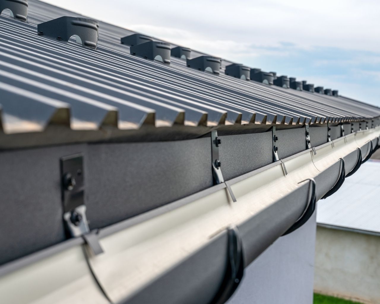 Gutter repair and downspout fix on a Surrey home